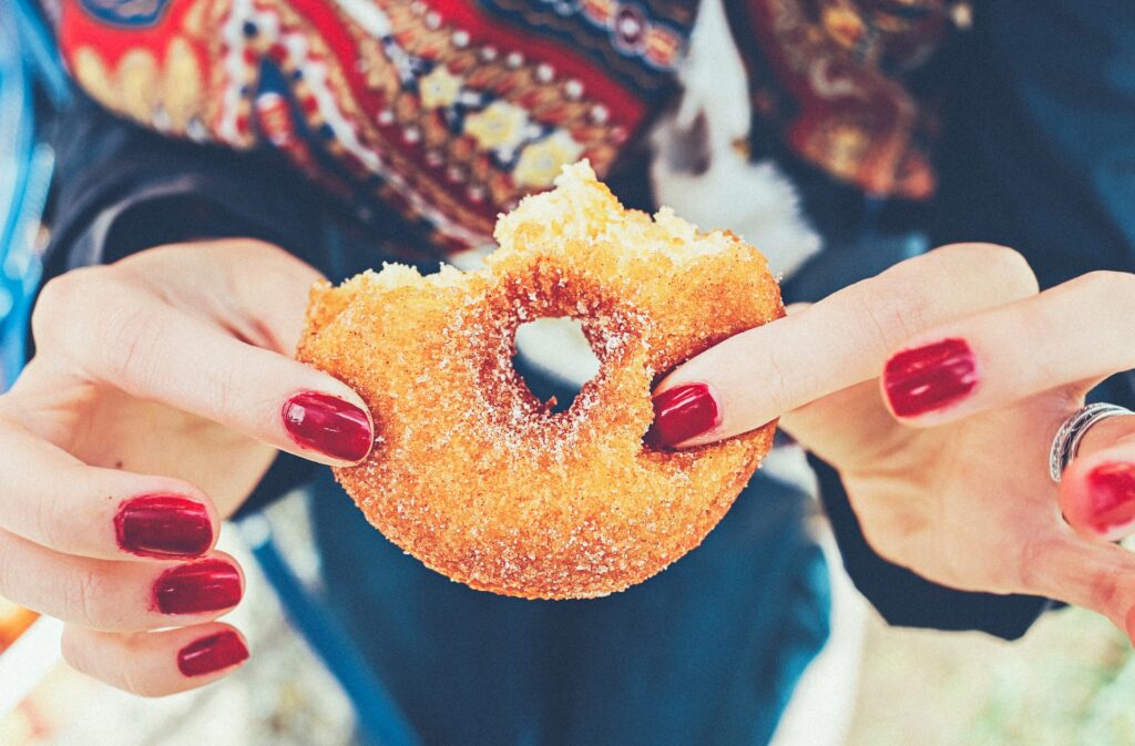 woman holding a doughnut